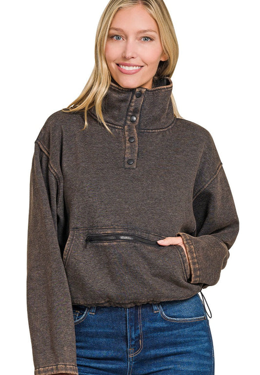 Woman wearing a brown pullover with a white background